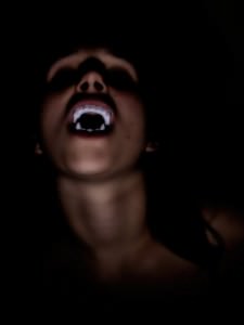 Vampire exposing teeth